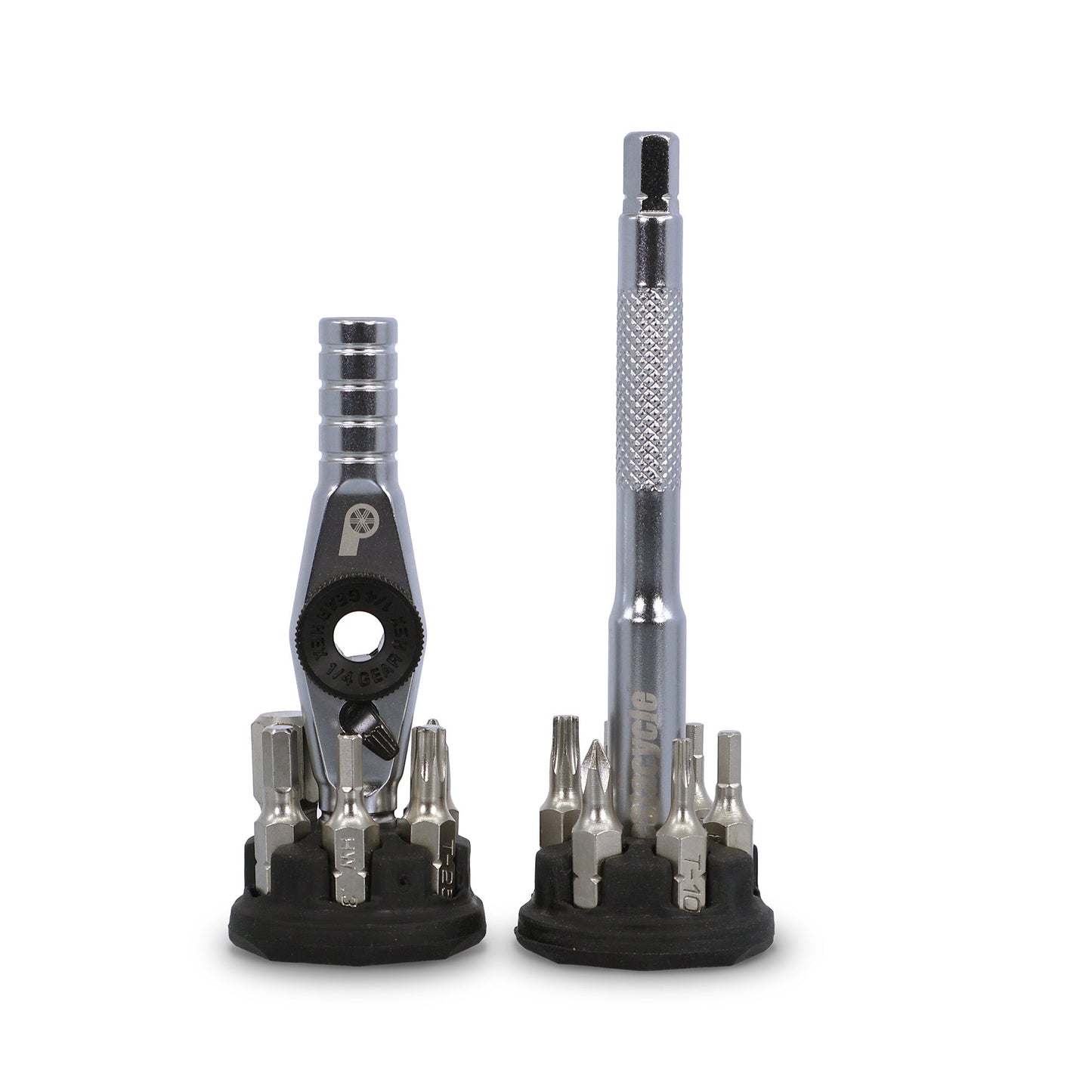 The Prestacycle T-Ratchet Pro Set includes two compact desktop ratchet sets: one with a T-handle ratchet wrench and one with a screwdriver handle, both surrounded by interchangeable bits on black holders against a white background.