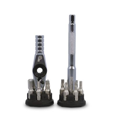 The Prestacycle T-Ratchet Pro Set includes two compact desktop ratchet sets: one with a T-handle ratchet wrench and one with a screwdriver handle, both surrounded by interchangeable bits on black holders against a white background.