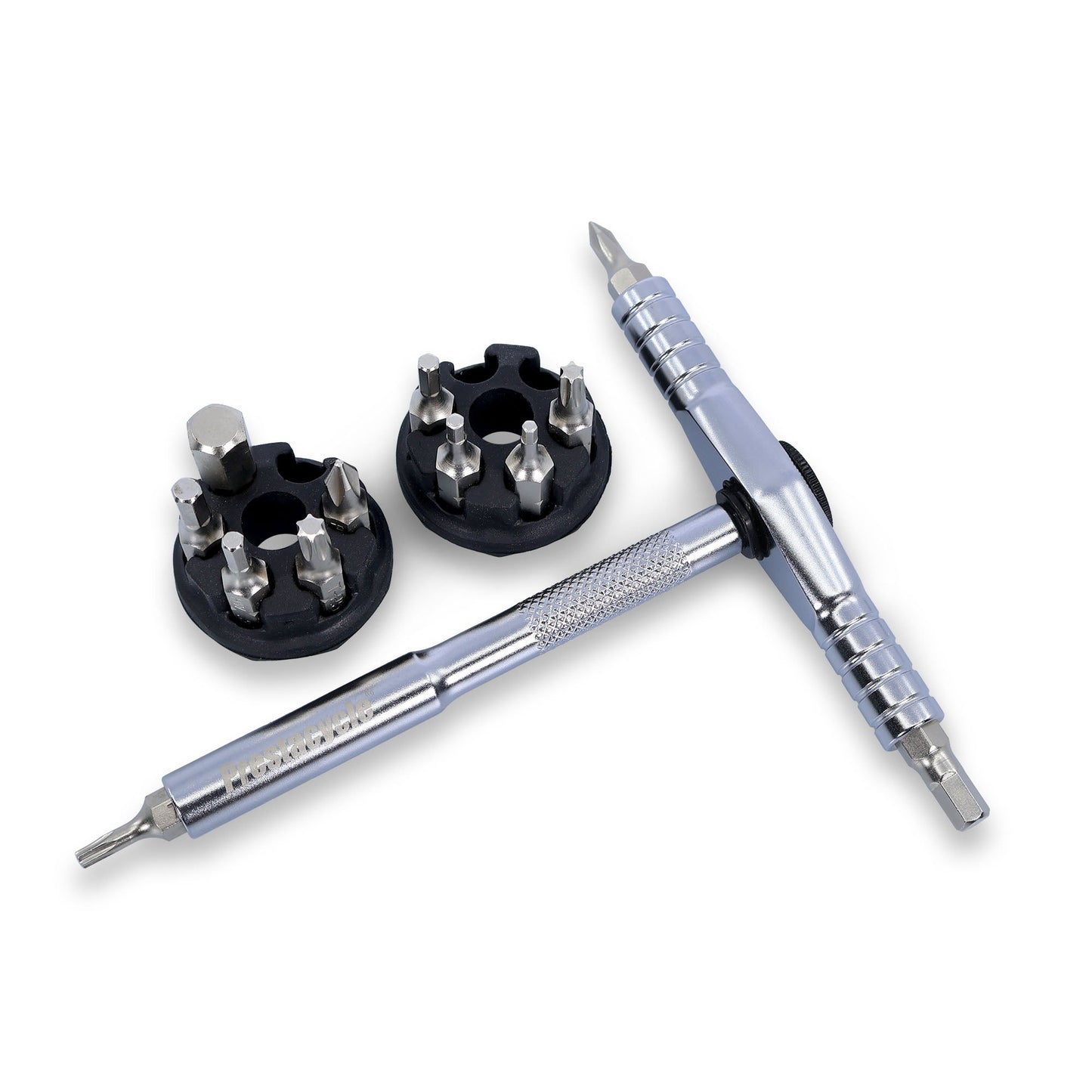 The Prestacycle T-Ratchet Pro Set features a silver multi-tool with a textured handle and two black circular holders for screwdriver and hex bits. Its interchangeable ends make it a versatile addition to any desktop ratchet set.