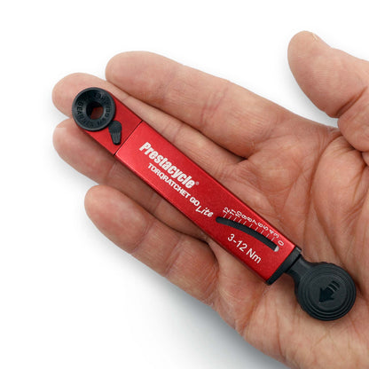 Prestacycle TorqRatchet GO Lite - A red and black torque multi-tool ratchet with a black knob and red handle, labeled for 3-12Nm